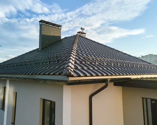 modern-house-with-a-tiled-roof-and-chimney-2026-03-16-02-06-36-utc